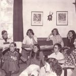 Group of 13 students gathered in a lounge.