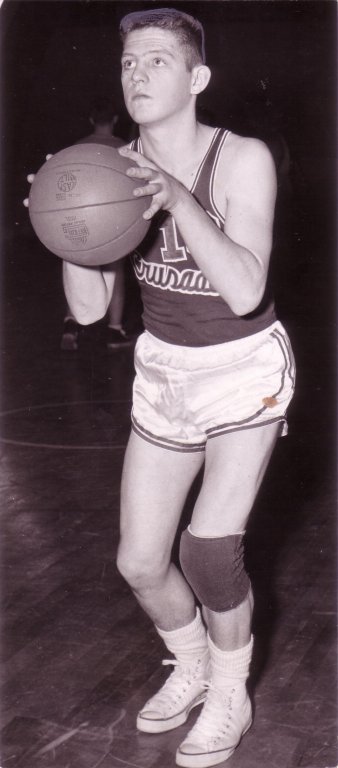Basketball player getting ready to make a shot with a basketball.