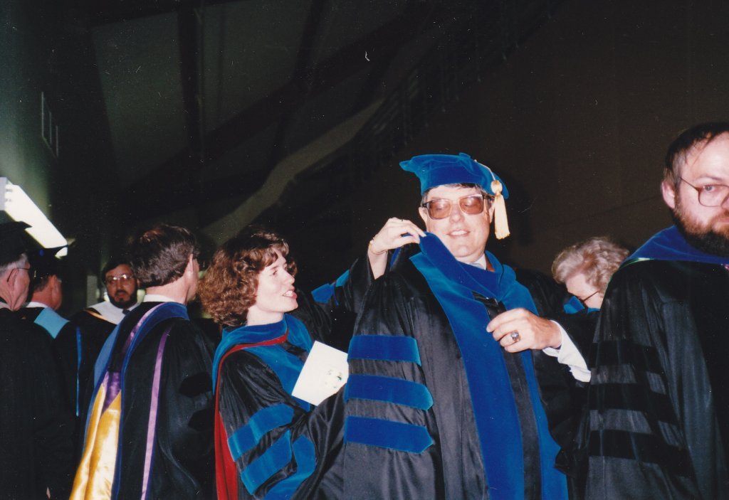 Doctor Susan Baillet and Doctor Robert Duff with others in academic regalia.