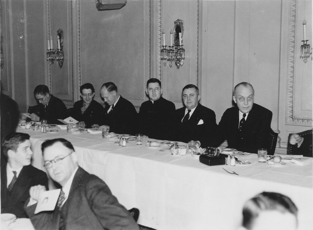 People seated at a banquet table.