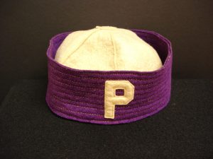 white beanie cap with purple band