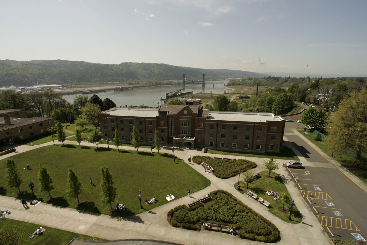 Corrado Hall with the Willamette River and Saint Johns Bridge in the background.