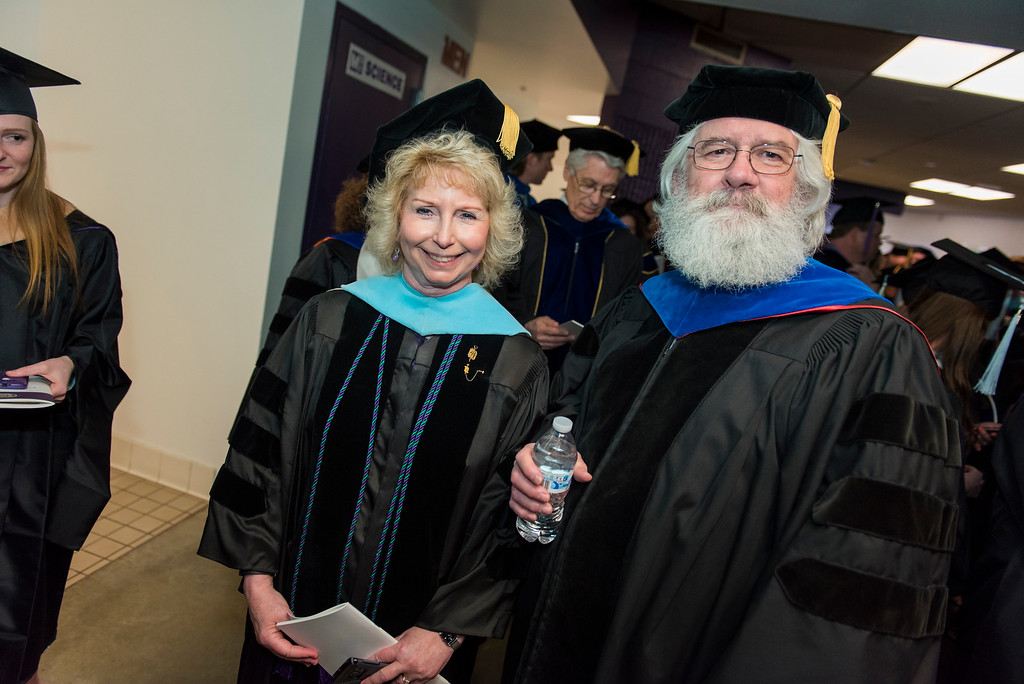 Doctor Jacqueline Waggoner and Doctor James Carroll in academic regalia.