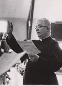 Fr. George Dum, C.S.C., directing choir, 1975 (click to enlarge photo)