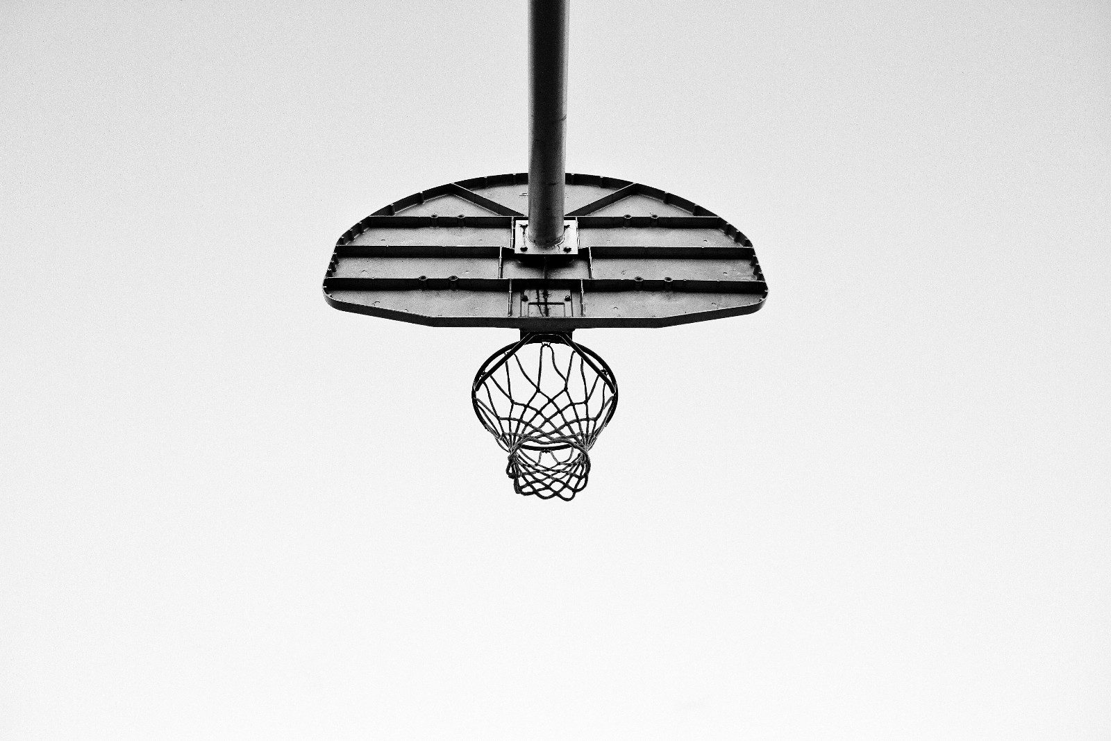 a basketball hoop seen from below and behind