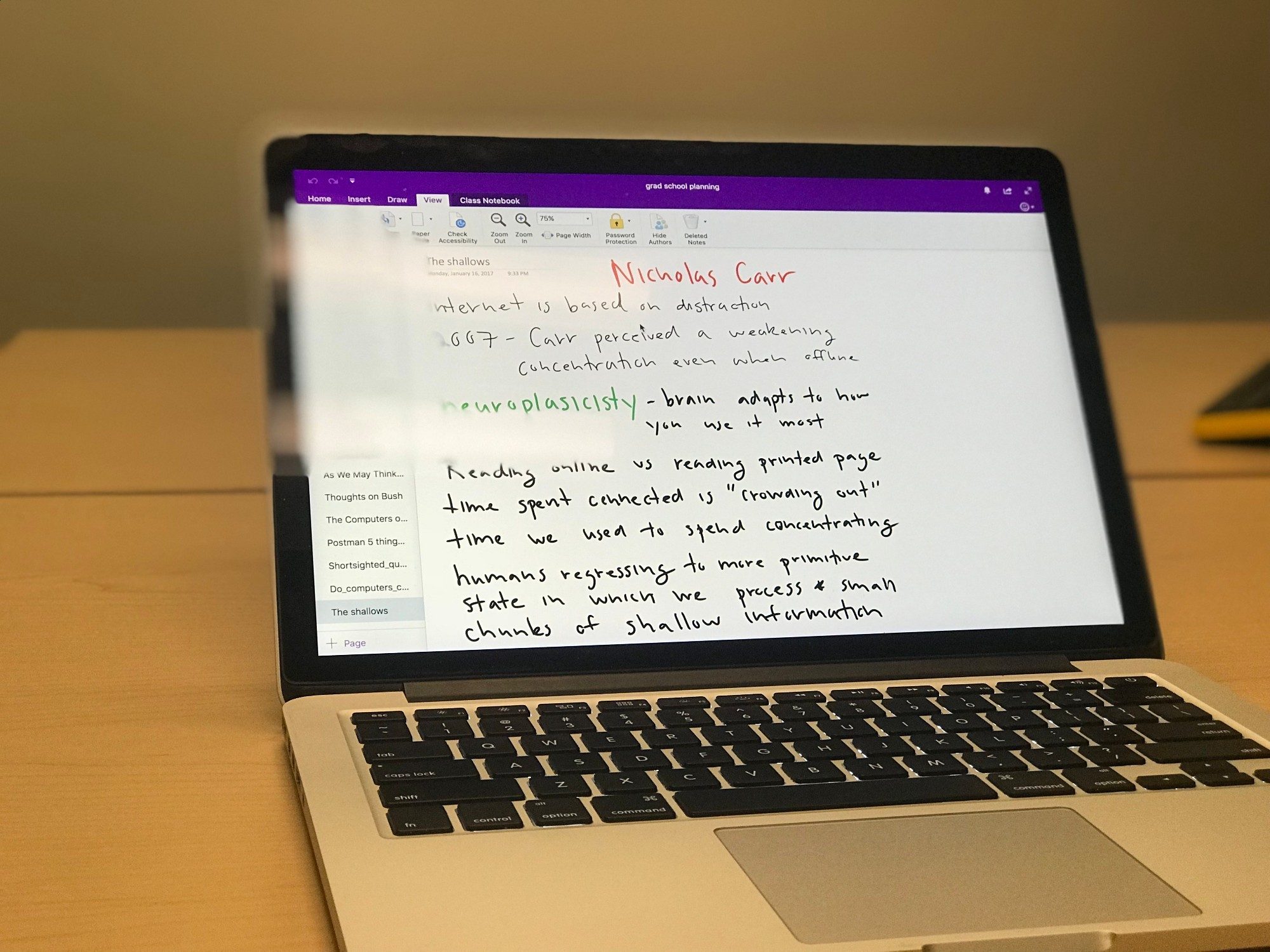 a laptop with digital handwriting on the screen